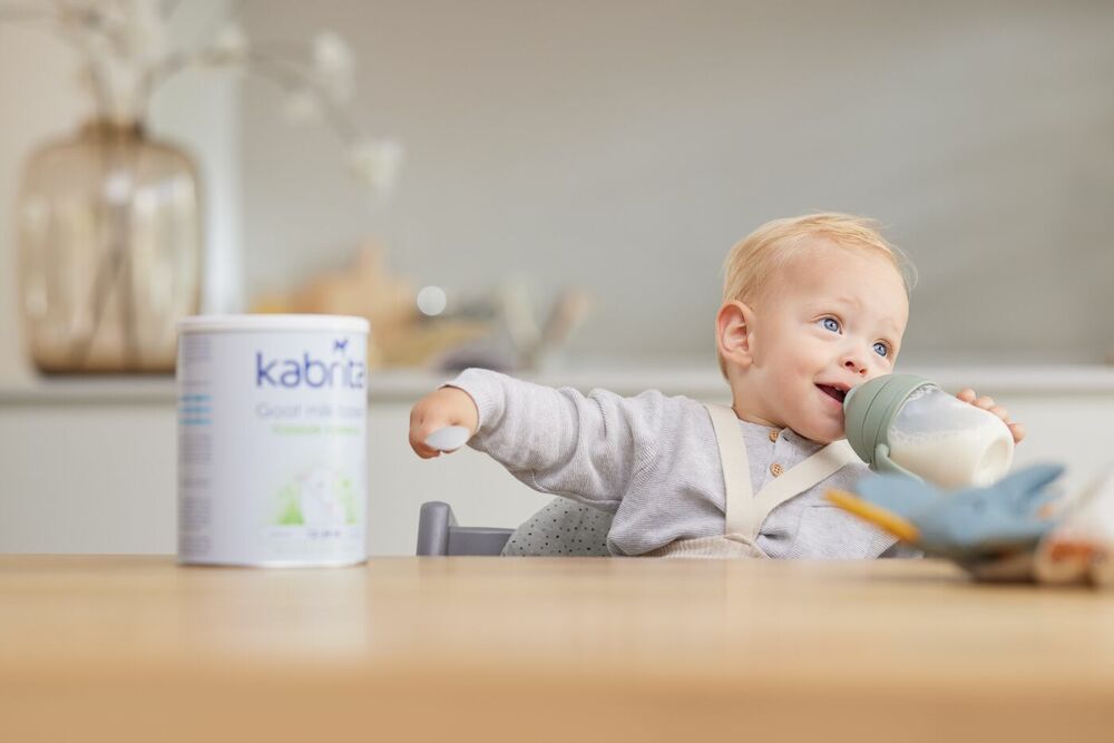 Baby drinking goat milk formula for easier digestion and less gas and bloating